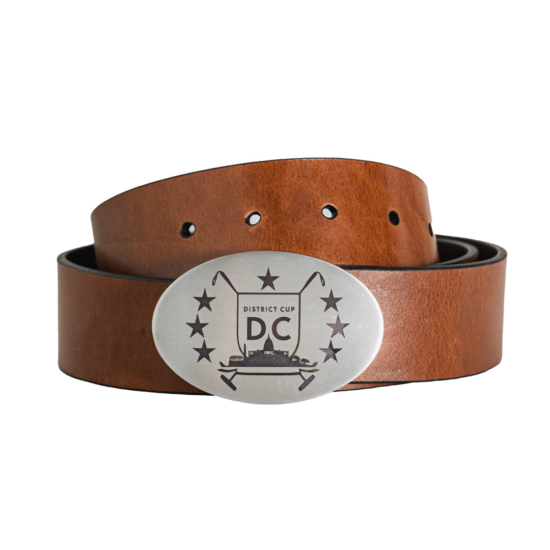 Brown leather belt with a silver belt buckle engraved with The District Cup logo