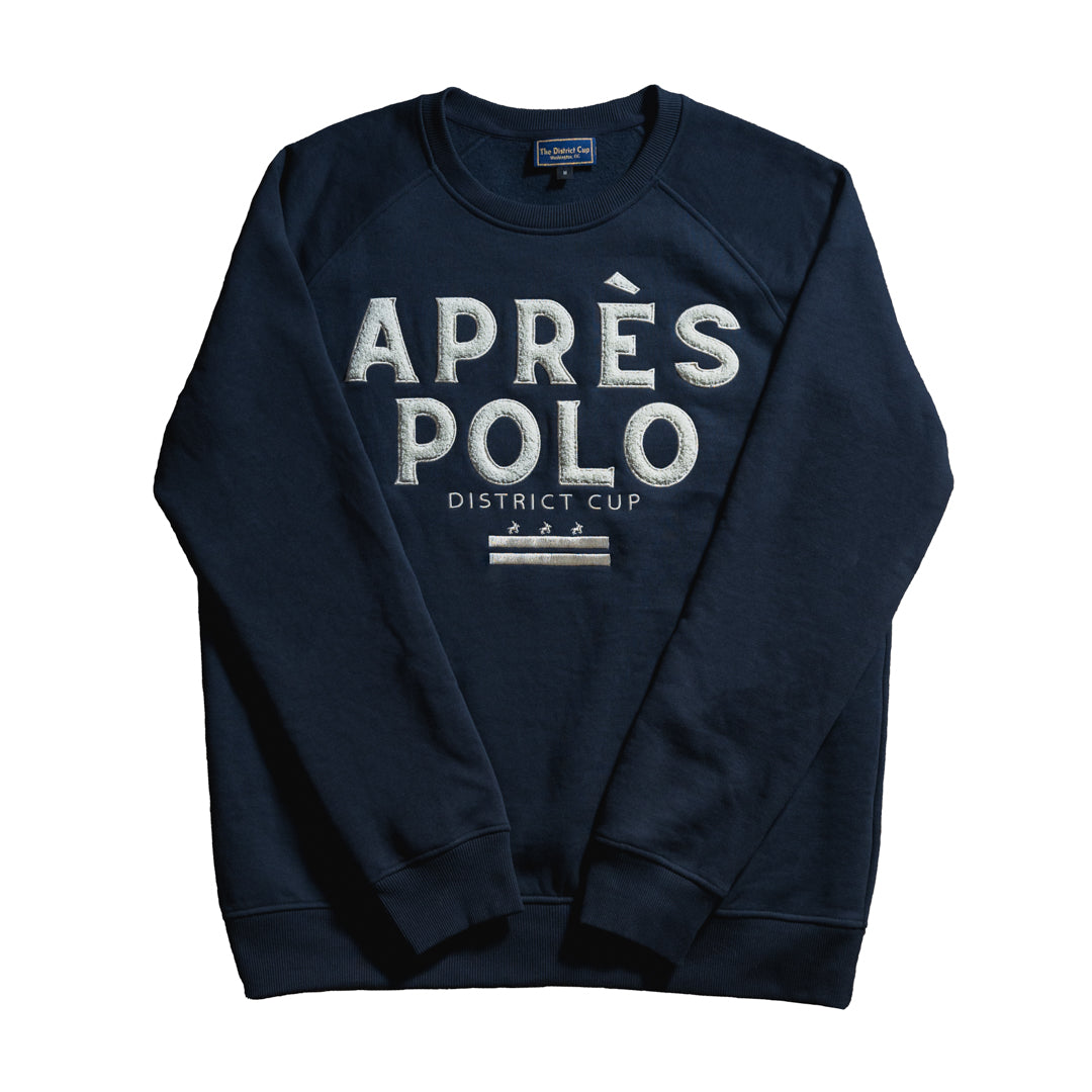 Navy crew neck sweatshirt from The District Cup Heritage Collection featuring bold ‘APRÈS POLO’ embroidery and subtle Washington D.C.-inspired detailing.